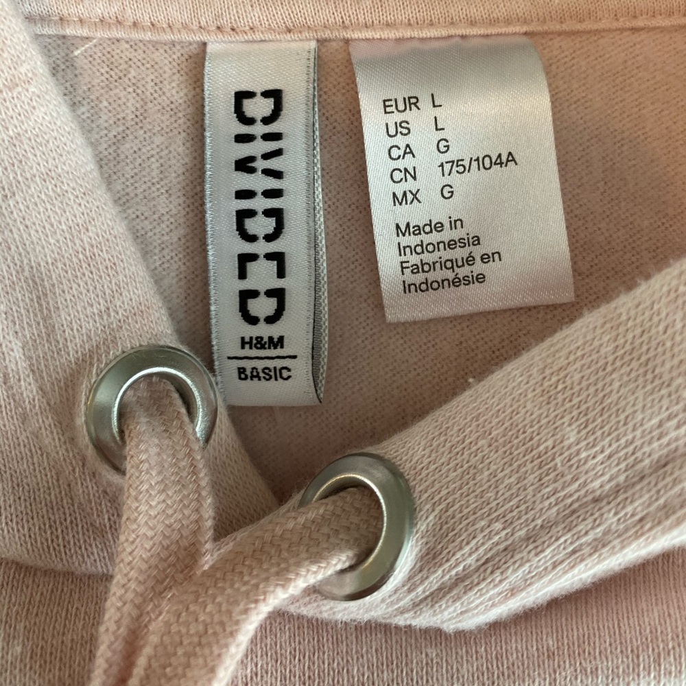 A light pink cropped hoodie
